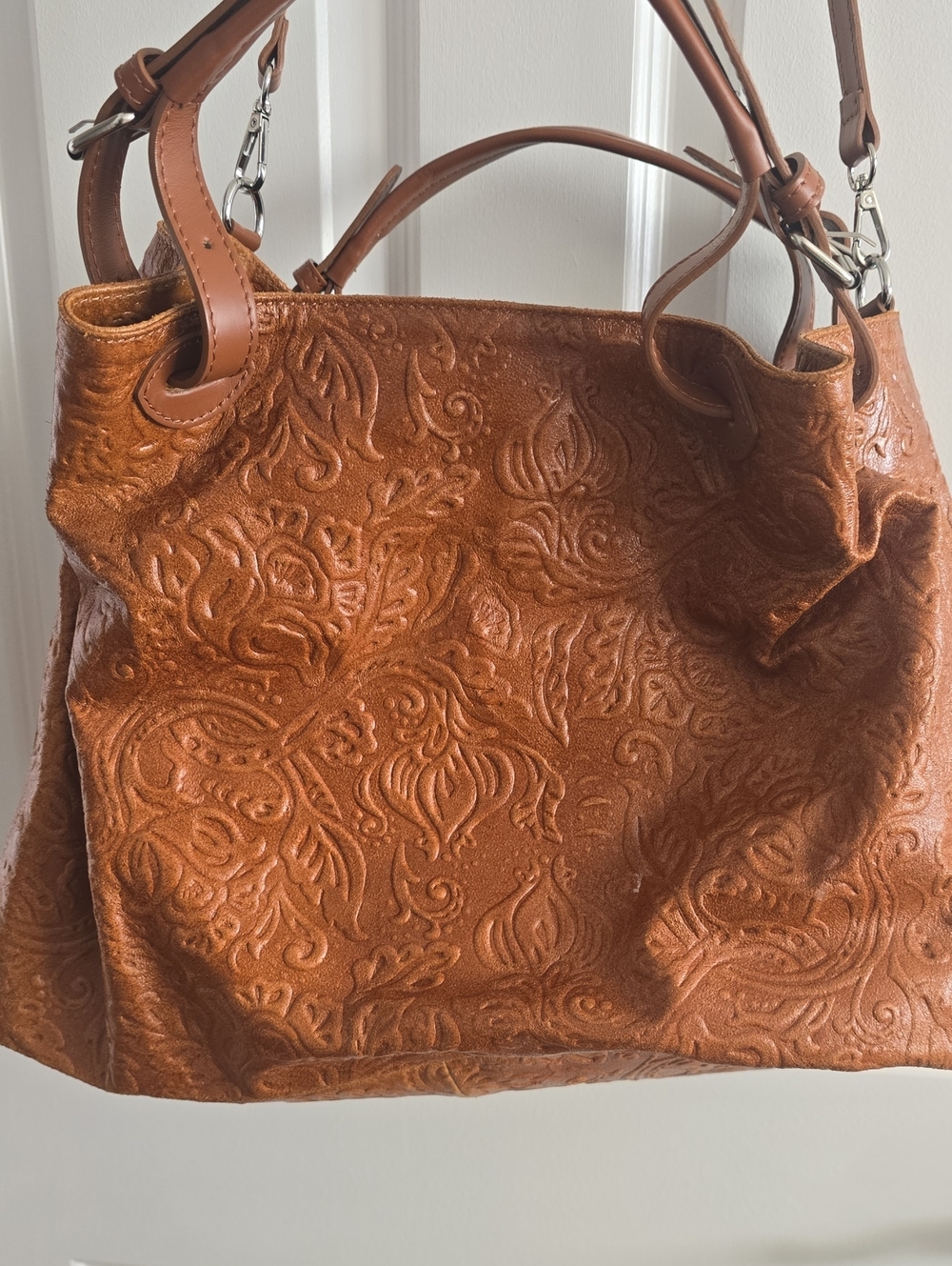 Embossed Leather Floral Tote Bag in Cognac Brown.